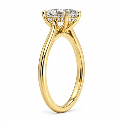 Side view of an oval moissanite engagement ring with four-prong setting and hidden halo