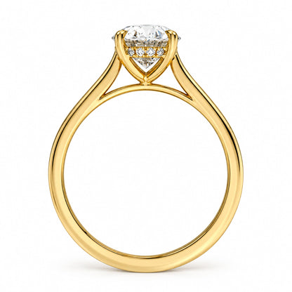 Profile view of the Celeste oval hidden halo moissanite ring in yellow gold plated silver