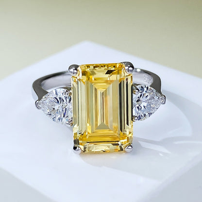 Yellow 4 Carat Emerald Cut Three-Stone Ring