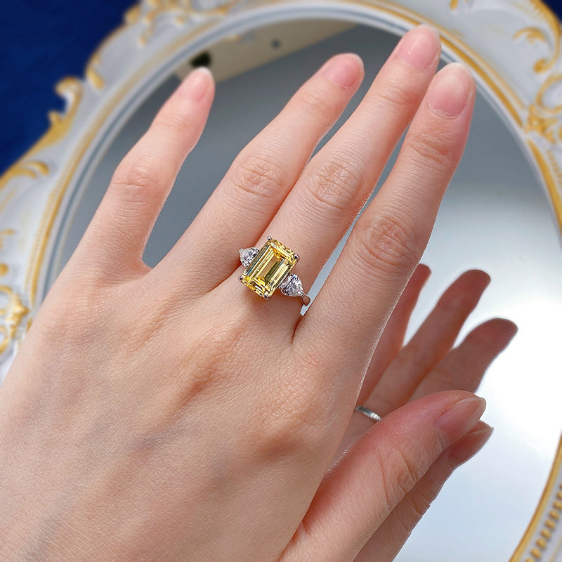 Yellow 4 CT Emerald Cut Three-Stone Ring. Silver 925