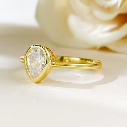 Bezel Set Pear Solitaire Ring. Silver 925. White Gold Plated