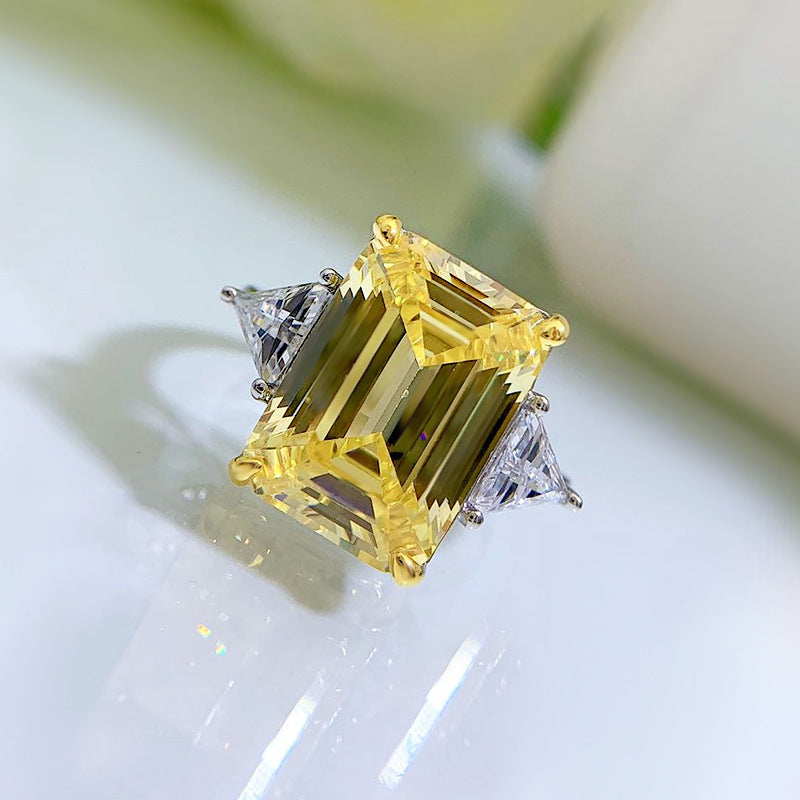 6.5 Carat Yellow Diamond Emerald Cut Three-Stone Ring
