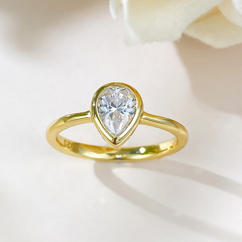 Bezel Set Pear Solitaire Ring. Travel Engagement RIng