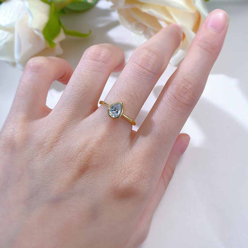 Bezel Set Pear Solitaire Ring. White Gold Plated