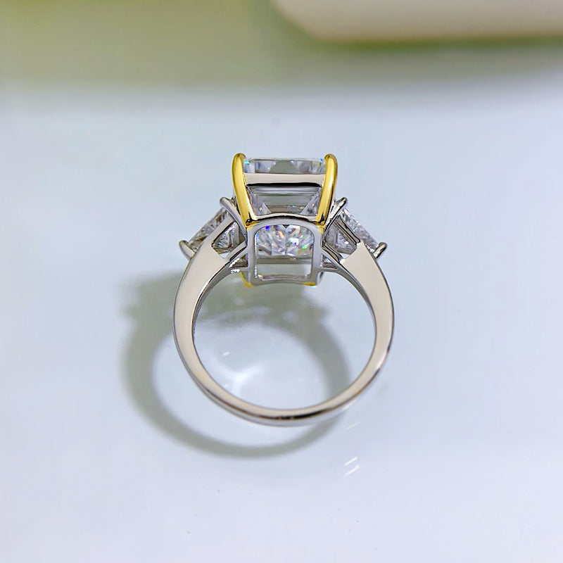 6.5 CT Emerald Cut Three-Stone Ring. Two Tone Ring