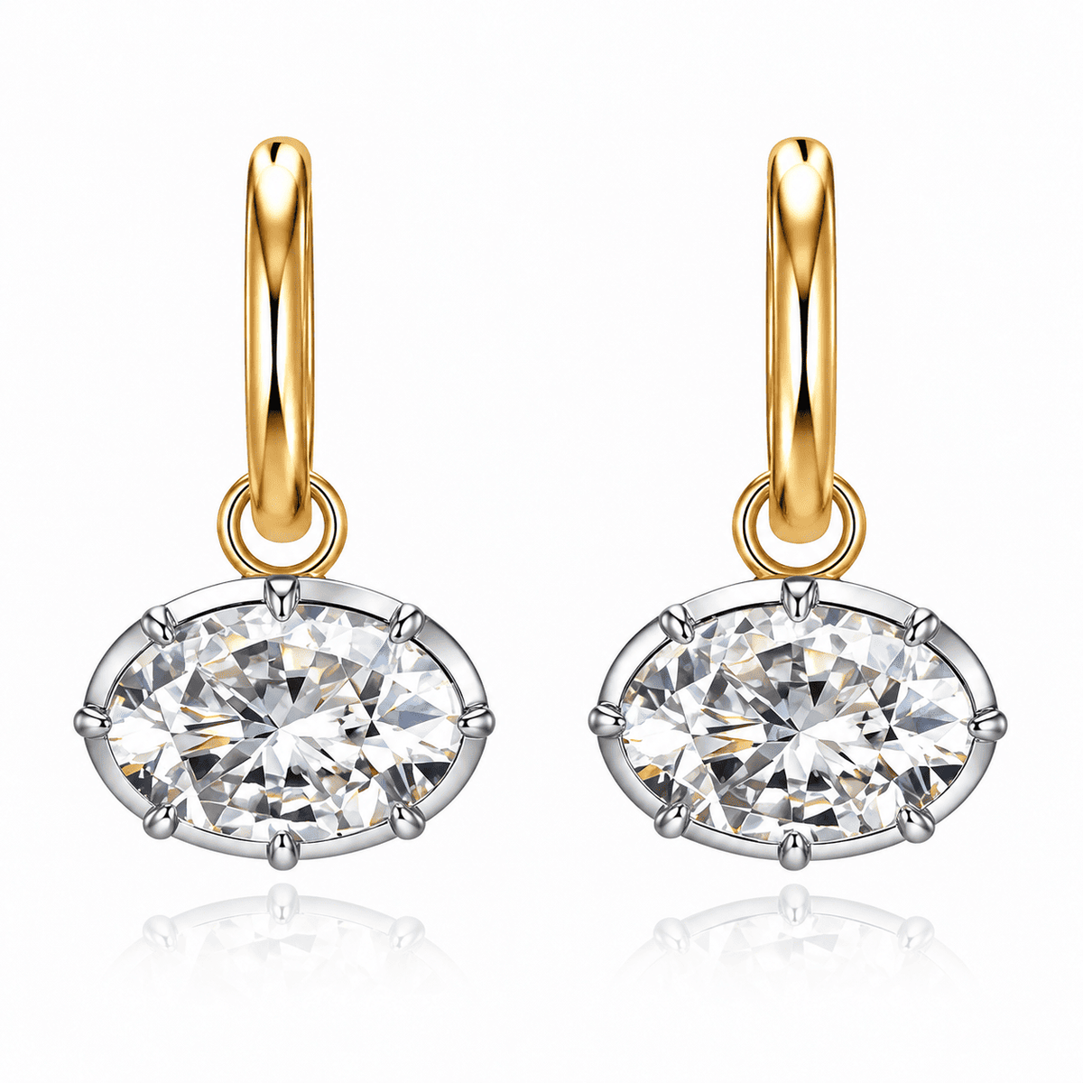 Pair of ANNXMEE Iconic two-tone hoop earrings with horizontal oval moissanite drops on a white background